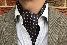 Leon Thomas in a jacket and ascot